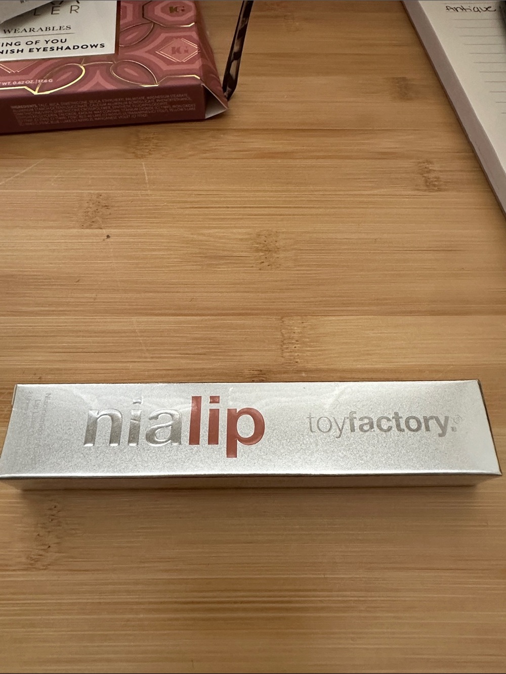 nia lip Toyfactory Metallic Silver Lipstick Packaging - Silver with Rose Accents